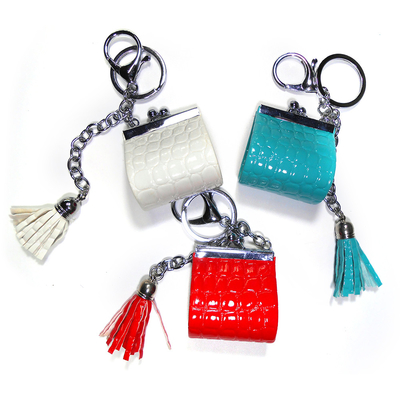 Sliver Plating Smooth Surface Coin Bag Keychain With Red Tassel